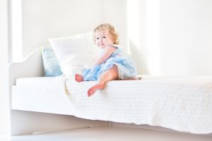 Toddler climbing out of bed